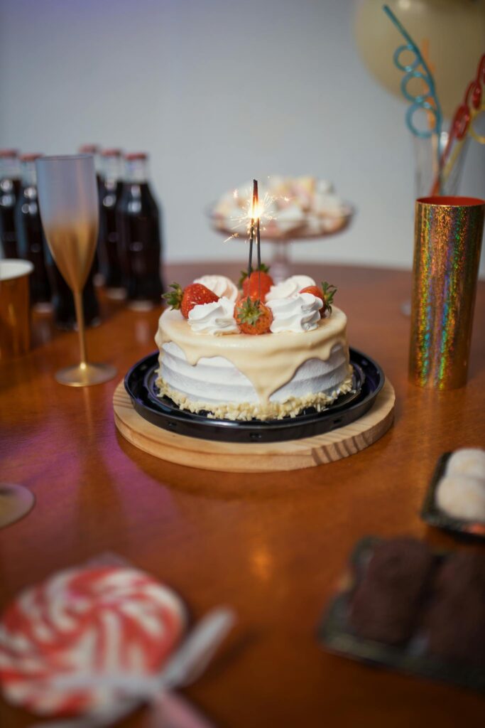 A vibrant Brazilian birthday setup featuring a cake, drinks, and festive decorations.